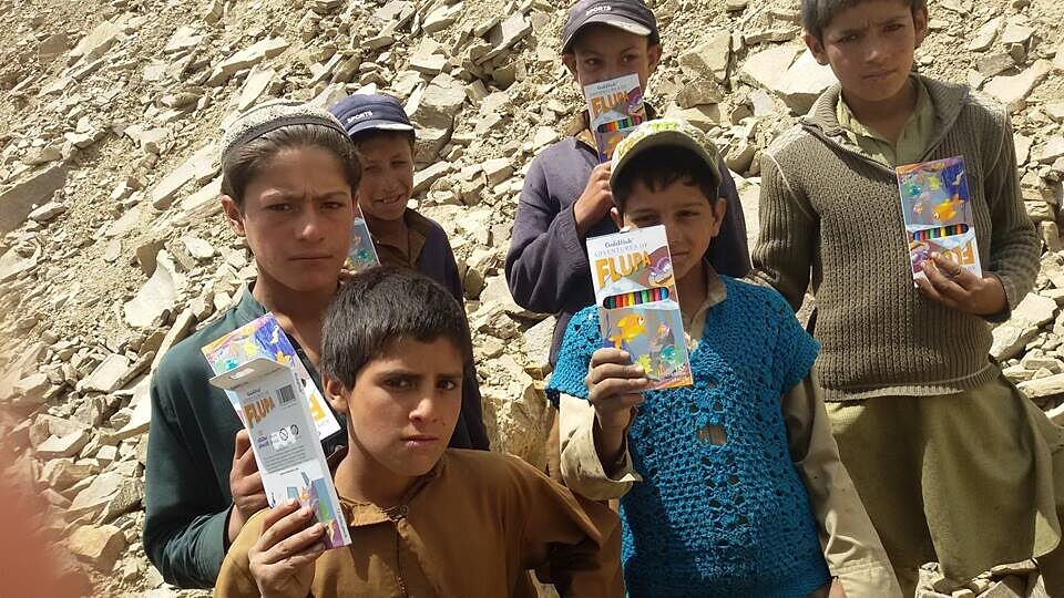 Children with new coloring and learning kits