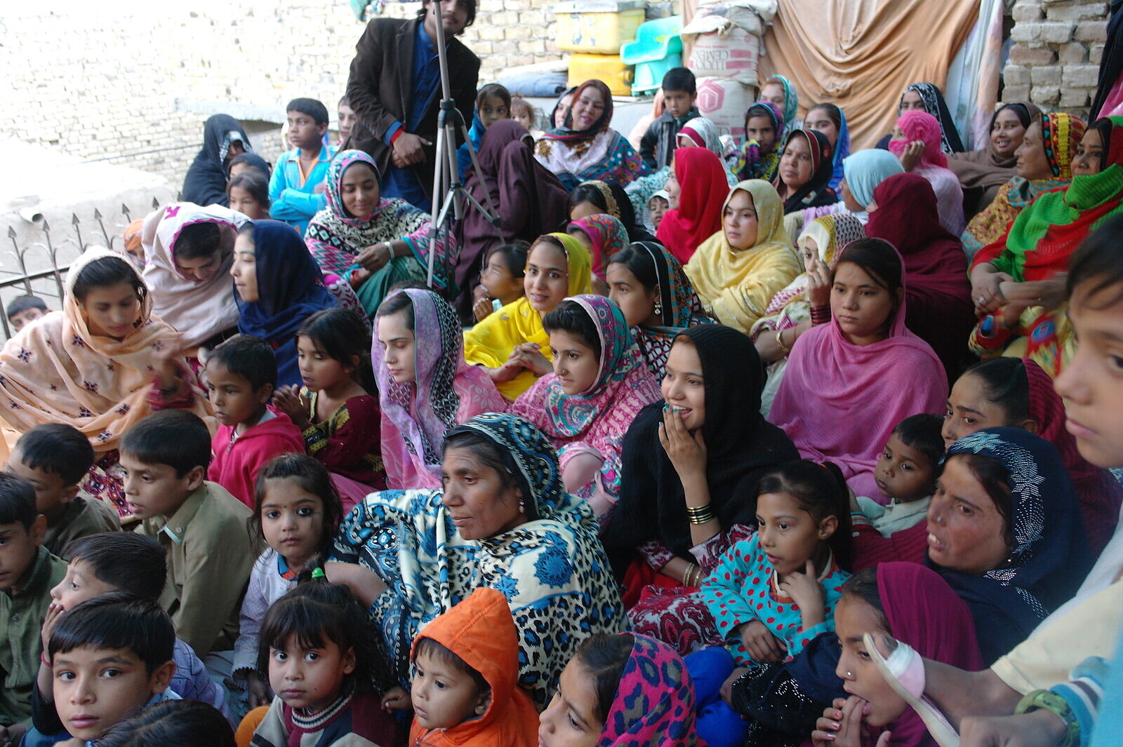 Women and children gather for a community event