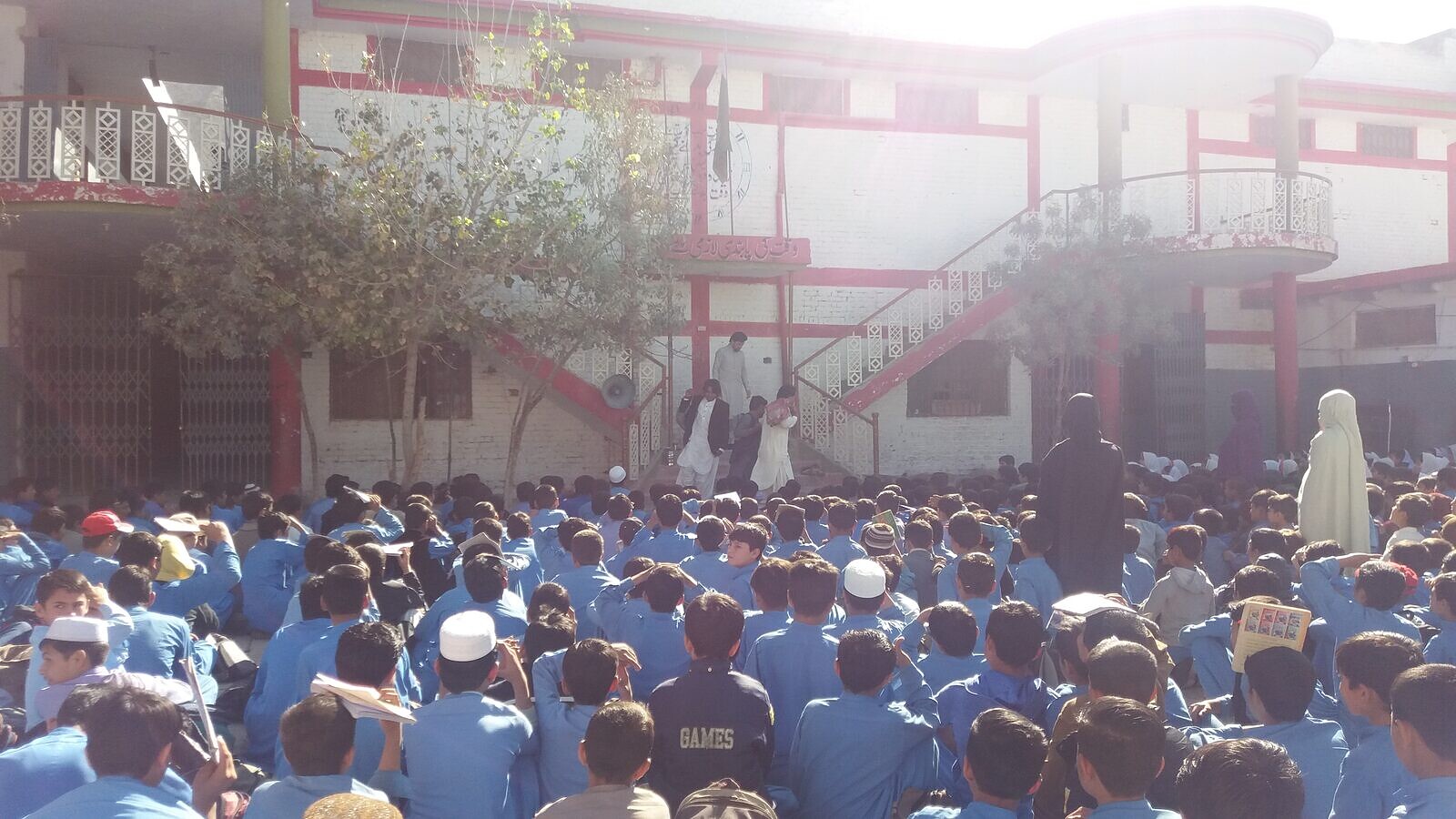 Students gather in a school courtyard