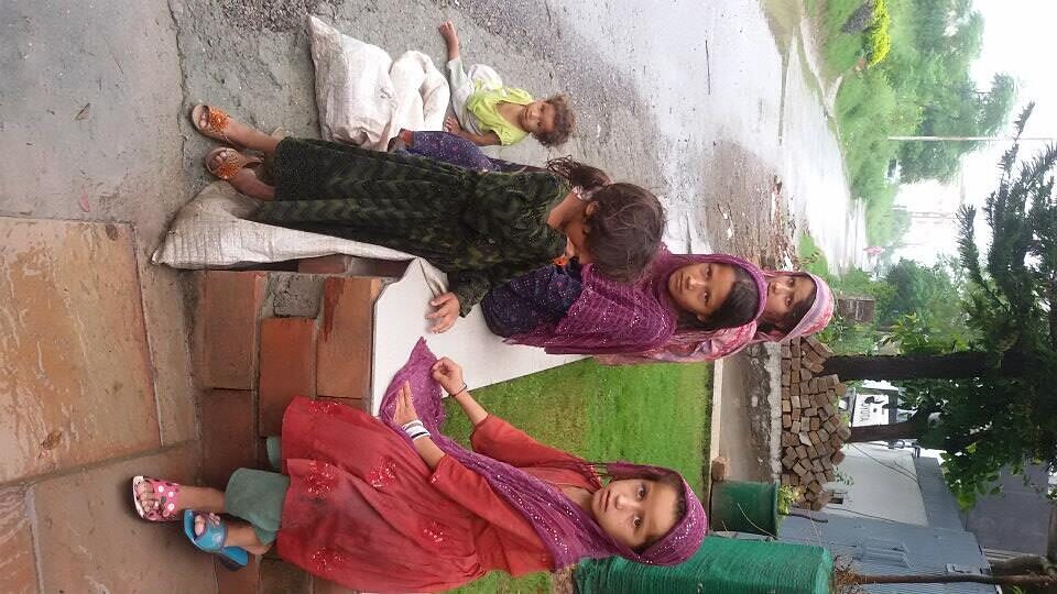 Girls in traditional dress at a community event