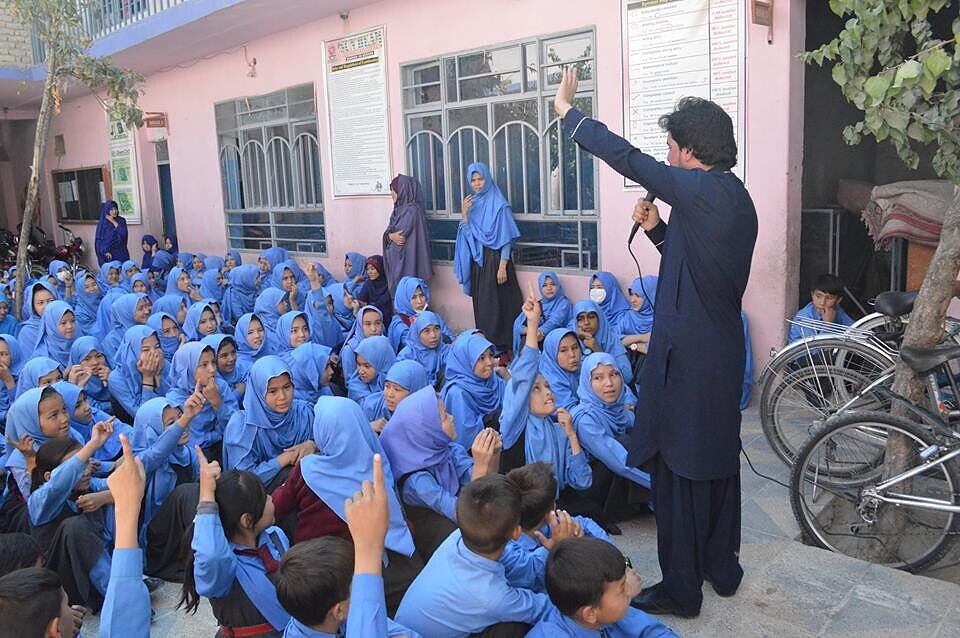 A community leader addresses students