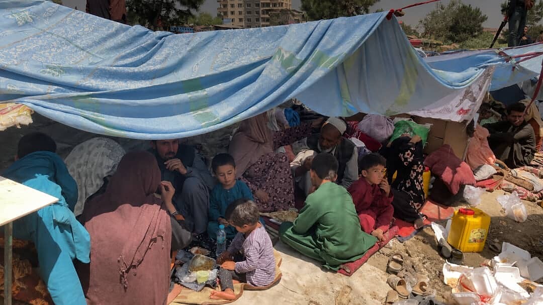 A family sheltering together, receiving support and supplies